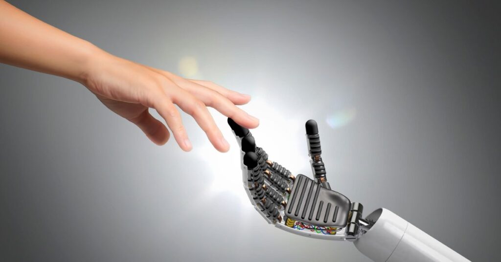 Human hand reaching toward a robotic hand, symbolizing AI, technology, innovation, and human-machine connection.