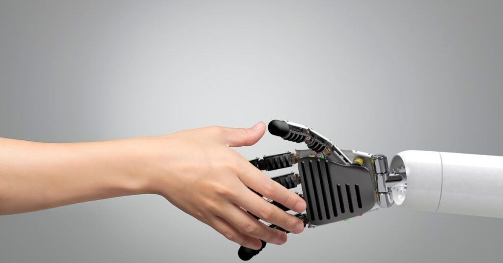 Human hand shaking a robotic hand, symbolizing artificial intelligence, automation, and human-tech collaboration.
